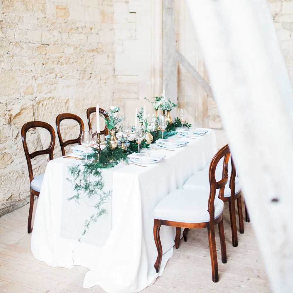Elegant Place Setting With Gold Cutlery & Foliage Table Runner