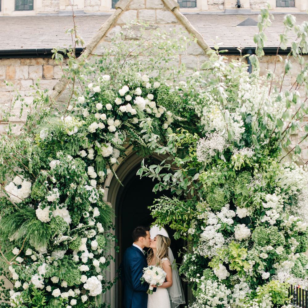 Bride & Groom Flower Arch Portrait