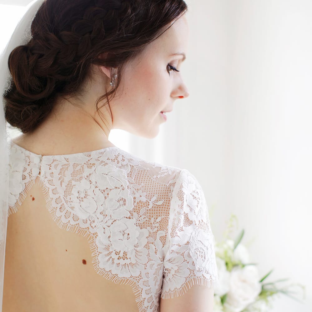Bride in Backless Jesús Peiró Wedding Dress