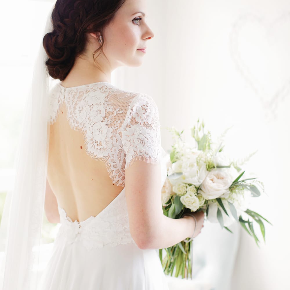 Bride in Keyhole Back Jesús Peiró Wedding Dress