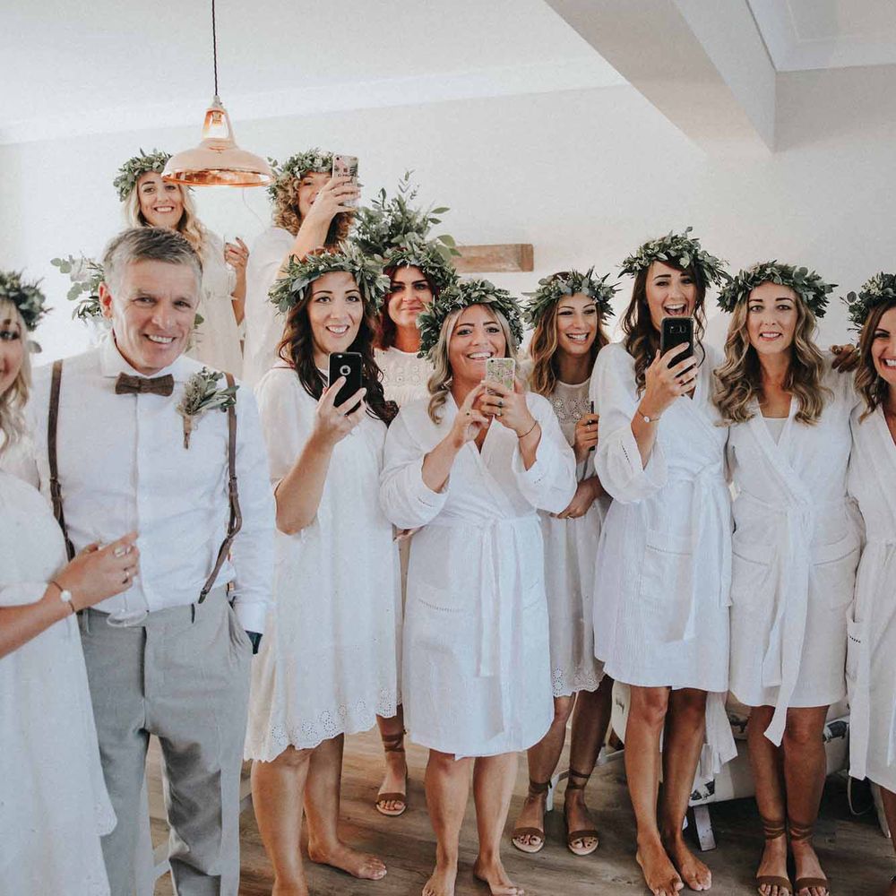 Bridesmaids In White Dresses With Foliage Crowns // Abbi From Save The Date Magazine Gets Married Wearing Margaux Taridts & Grace Loves Lace Outdoor Festival Wedding With Tipis, Bell Tent Camping & Festoon Lights