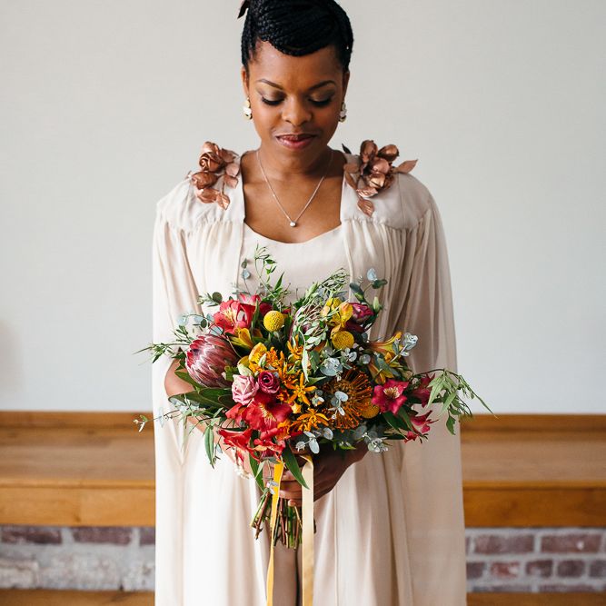 Bright Bouquets with Proteas | Bride in Bespoke Ailsa Monroe Jumpsuit & Cape | Relaxed Industrial Wedding at Ocean Studios, Plymouth | Freckle Photography