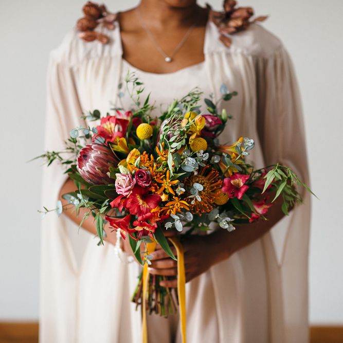 Bright Bouquets with Proteas | Bride in Bespoke Ailsa Monroe Jumpsuit & Cape | Relaxed Industrial Wedding at Ocean Studios, Plymouth | Freckle Photography