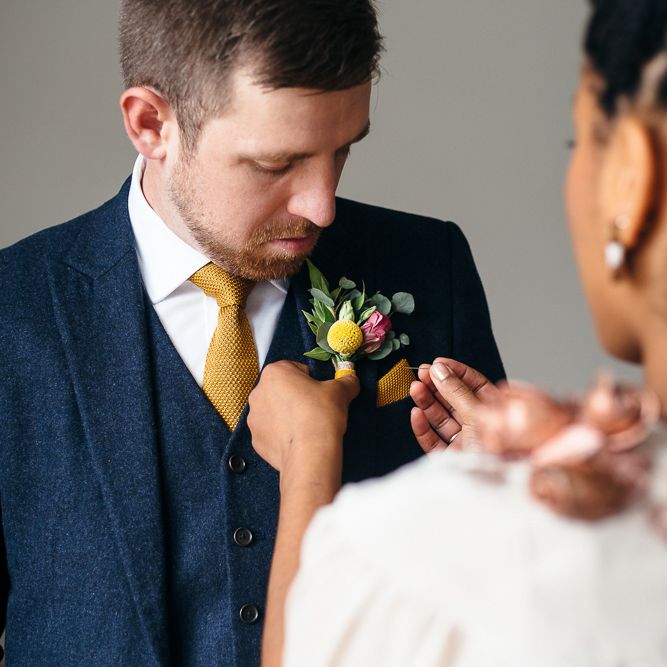 Bride in Bespoke Ailsa Monroe Jumpsuit & Cape | Groom in Next Navy Wool Suit | Relaxed Industrial Wedding at Ocean Studios, Plymouth | Freckle Photography