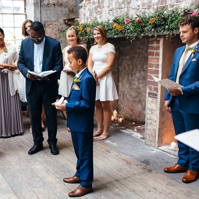 Wedding Ceremony | Bride in Bespoke Ailsa Monroe Jumpsuit & Cape | Groom in Next Navy Wool Suit | Relaxed Industrial Wedding at Ocean Studios, Plymouth | Freckle Photography