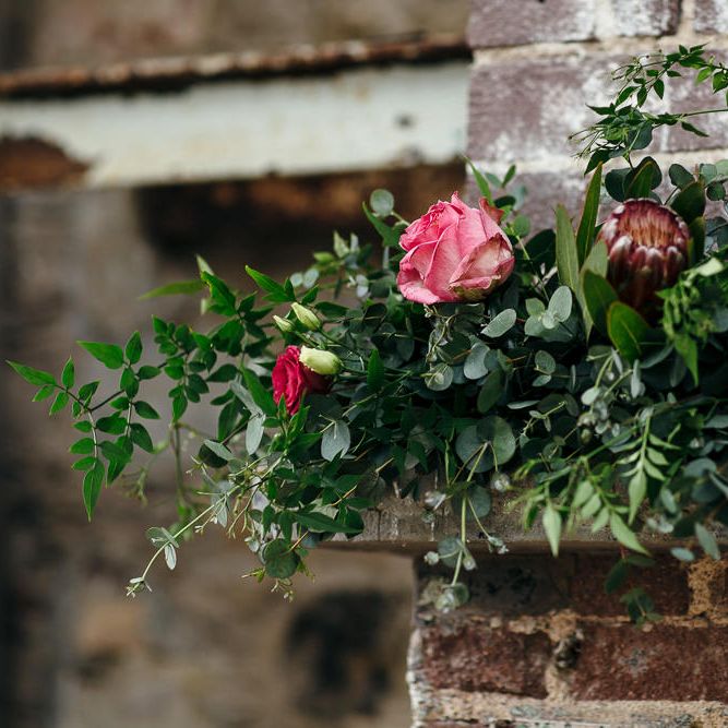 Fireplace Wedding Flower Display | | Relaxed Industrial Wedding at Ocean Studios, Plymouth | Freckle Photography