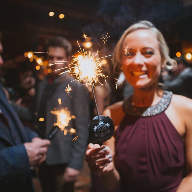 Bridesmaid in Burgundy Warehouse Dress with Sparkler