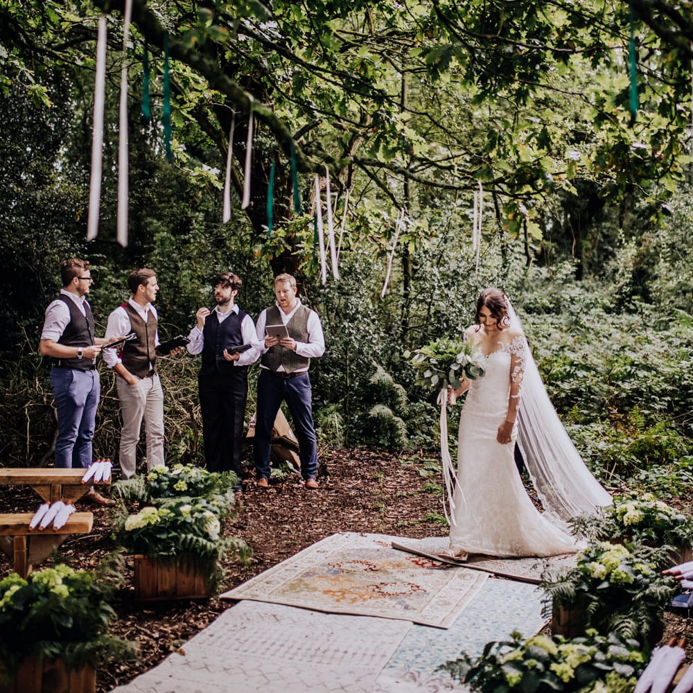 Outdoor Wedding Ceremony | Bride in Rosa Clara Naim Bridal Gown | Persian Rug Aisle | Stylish Woodland Wedding in Cheshire | Clara Cooper Photography | Story Board Weddings Films