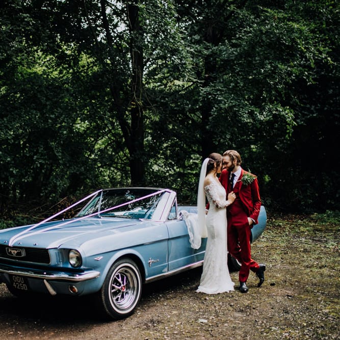 Mustang Wedding Car | Bride in Rosa Clara Naim Bridal Gown | Groom in Bespoke Burgundy Suit | Stylish Woodland Wedding in Cheshire | Clara Cooper Photography | Story Board Weddings Films