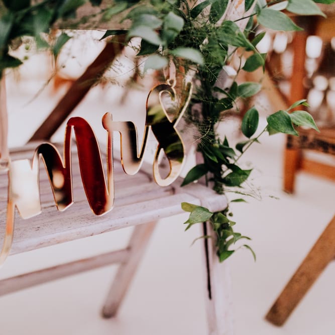 Copper Mrs Chair Back Decor | Stylish Woodland Wedding in Cheshire | Clara Cooper Photography | Story Board Weddings Films