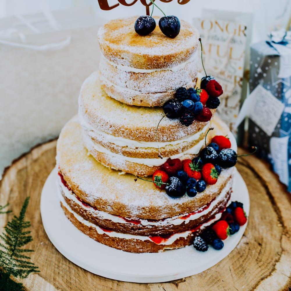 Naked Wedding Cake with Fruit Decor | Stylish Woodland Wedding in Cheshire | Clara Cooper Photography | Story Board Weddings Films