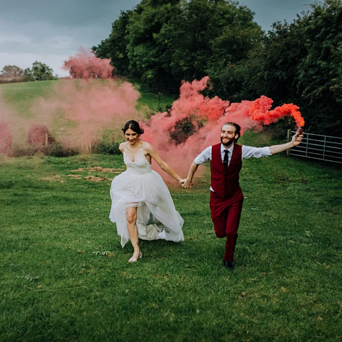 Smoke Bomb | Bride in Bo & Luca Bridal Gown | Groom in Bespoke Burgundy Suit | Stylish Woodland Wedding in Cheshire | Clara Cooper Photography | Story Board Weddings Films