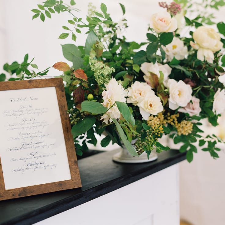 Floral Arrangement On Bar By Palais Flowers // Gold Cutlery With Pink Florals For Wedding // Image By Taylor And Porter