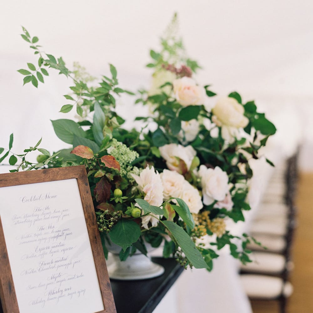 Floral Arrangement On Bar By Palais Flowers // Gold Cutlery With Pink Florals For Wedding // Image By Taylor And Porter
