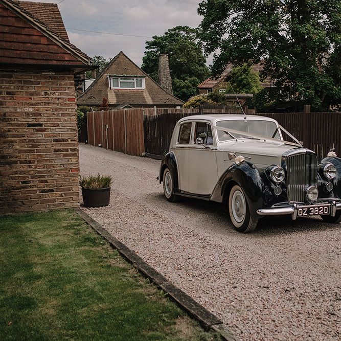 Bentley Wedding Car | White and Silver English Country Garden At Home Marquee Wedding | Jason Mark Harris Photography
