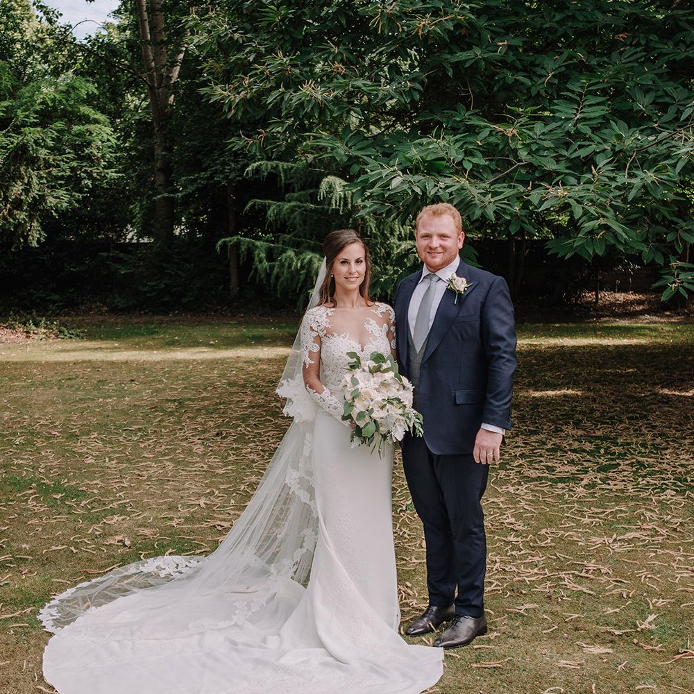 Bride in Lace Pronovias Bridal Gown | Groom in Thom Sweeney Suit | White and Silver English Country Garden At Home Marquee Wedding | Jason Mark Harris Photography