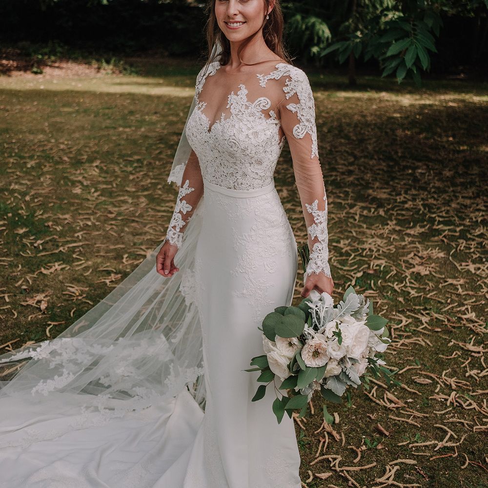 Bride in Lace Pronovias Bridal Gown | White and Silver English Country Garden At Home Marquee Wedding | Jason Mark Harris Photography