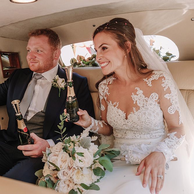 Bride in Lace Pronovias Bridal Gown | Groom in Thom Sweeney Suit | White and Silver English Country Garden At Home Marquee Wedding | Jason Mark Harris Photography