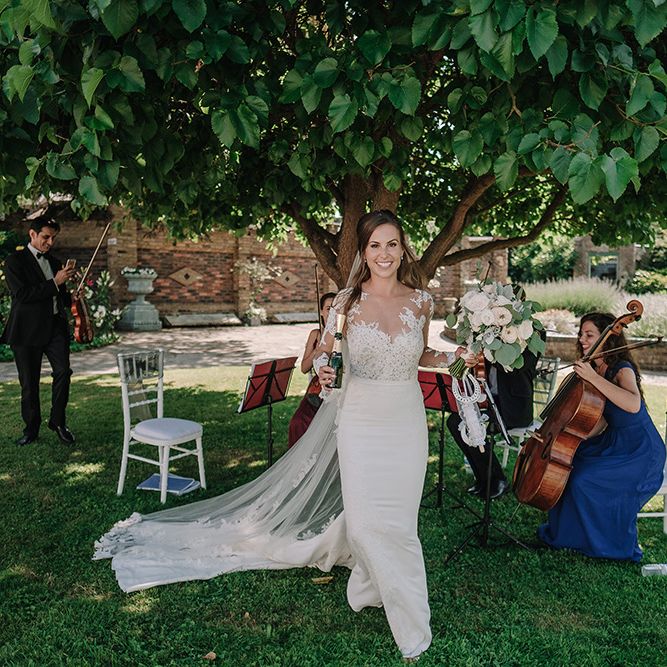 Bride in Lace Pronovias Wedding Dress | White and Silver English Country Garden At Home Marquee Wedding | Jason Mark Harris Photography