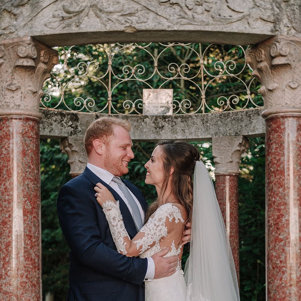 Bride in Lace Pronovias Bridal Gown | Groom in Thom Sweeney Suit | White and Silver English Country Garden At Home Marquee Wedding | Jason Mark Harris Photography