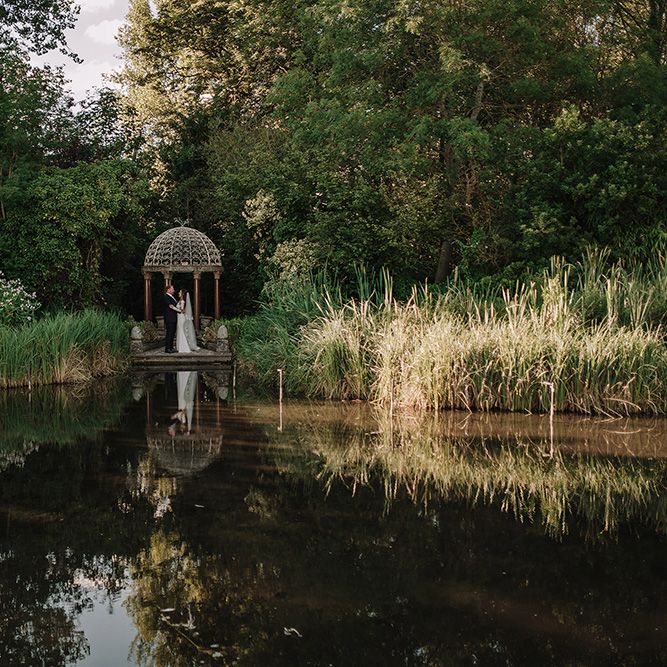 Bride in Lace Pronovias Bridal Gown | Groom in Thom Sweeney Suit | White and Silver English Country Garden At Home Marquee Wedding | Jason Mark Harris Photography