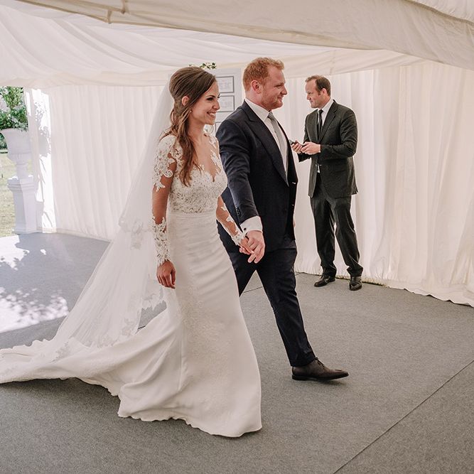 Bride in Lace Pronovias Bridal Gown | Groom in Thom Sweeney Suit | White and Silver English Country Garden At Home Marquee Wedding | Jason Mark Harris Photography