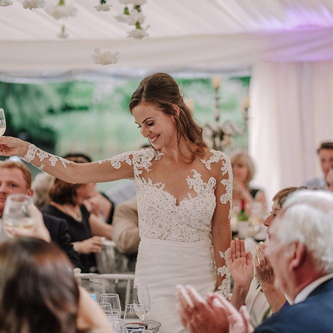 Bride in Lace Pronovias Bridal Gown | White and Silver English Country Garden At Home Marquee Wedding | Jason Mark Harris Photography