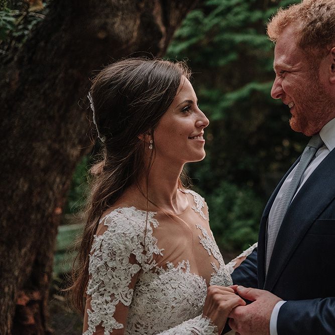 Bride in Lace Pronovias Bridal Gown | Groom in Thom Sweeney Suit | White and Silver English Country Garden At Home Marquee Wedding | Jason Mark Harris Photography