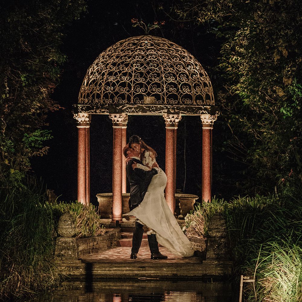 Bride in Lace Pronovias Bridal Gown | Groom in Thom Sweeney Suit | White and Silver English Country Garden At Home Marquee Wedding | Jason Mark Harris Photography