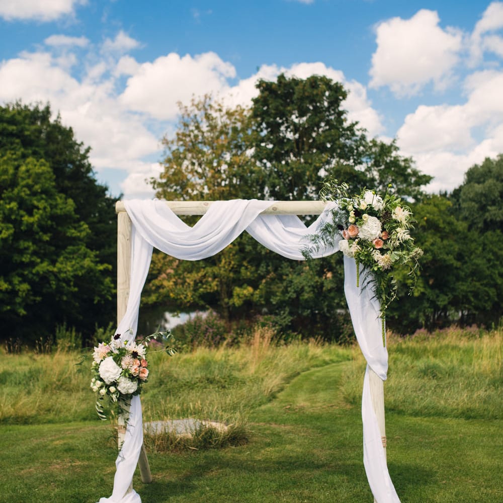 Draped Wedding Altar with Peach Flowers