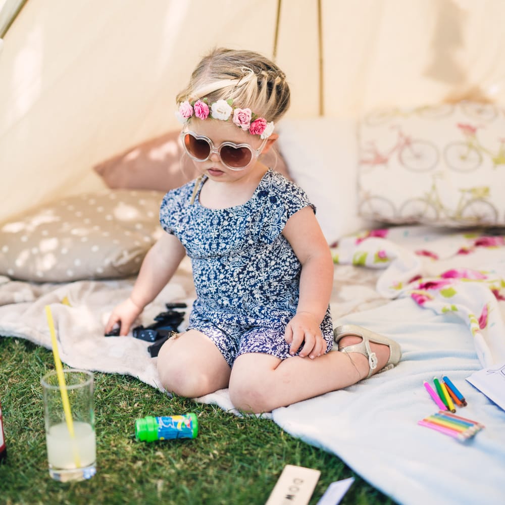 Cute Toddler with Heart Sunglasses & Flower in her Hair