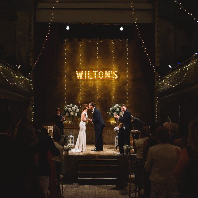 Wiltons Music Hall Wedding With Bride In Paloma Blanca And Bridesmaids In Sequinned Adrianna Papell Gowns Images By Jackson & Co Photography
