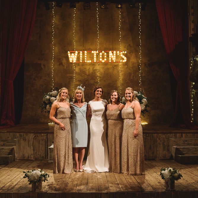 Wiltons Music Hall Wedding With Bride In Paloma Blanca And Bridesmaids In Sequinned Adrianna Papell Gowns Images By Jackson & Co Photography