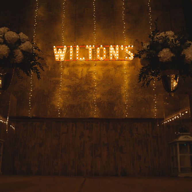 Wiltons Music Hall Wedding With Bride In Paloma Blanca And Bridesmaids In Sequinned Adrianna Papell Gowns Images By Jackson & Co Photography
