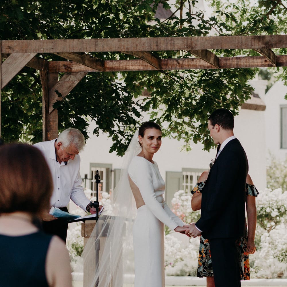 Wedding Ceremony | Bride in Houghton NYC Bridal Gown | Groom in Armani Suit | Stylish Outdoor Wedding at The Oaks Estate, Greyton, South Africa | Fiona Clair Photography | Ebert Steyn Films