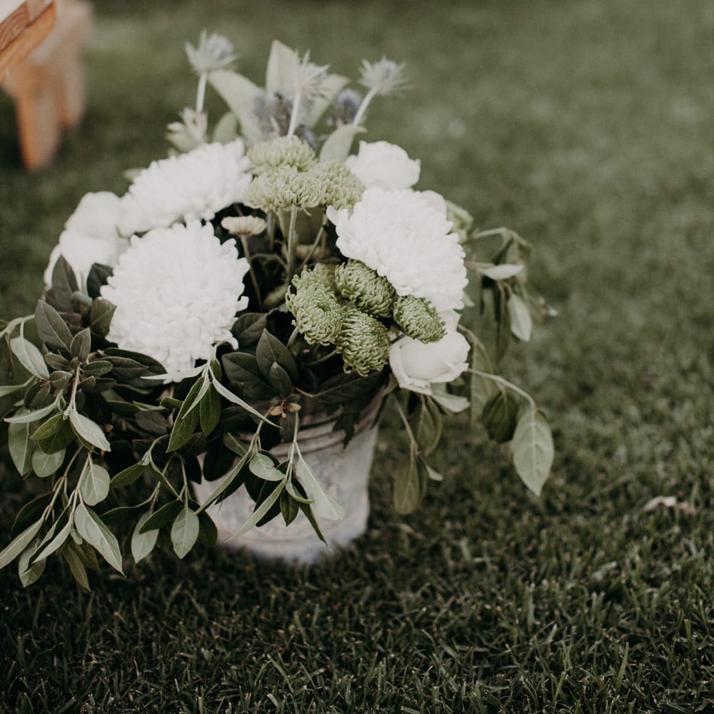 White Wedding Flowers in Bucket Lining the Aisle | Stylish Outdoor Wedding at The Oaks Estate, Greyton, South Africa | Fiona Clair Photography | Ebert Steyn Films