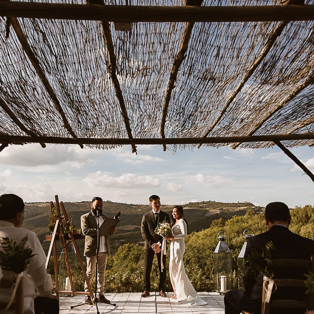 Intimate Tuscan Wedding at WP Relais, Castiglione D'orcia, Siena | Outdoor Reception with Fairy Light Decor | Bride in Gown from Cargie Threads | The Springles Photography