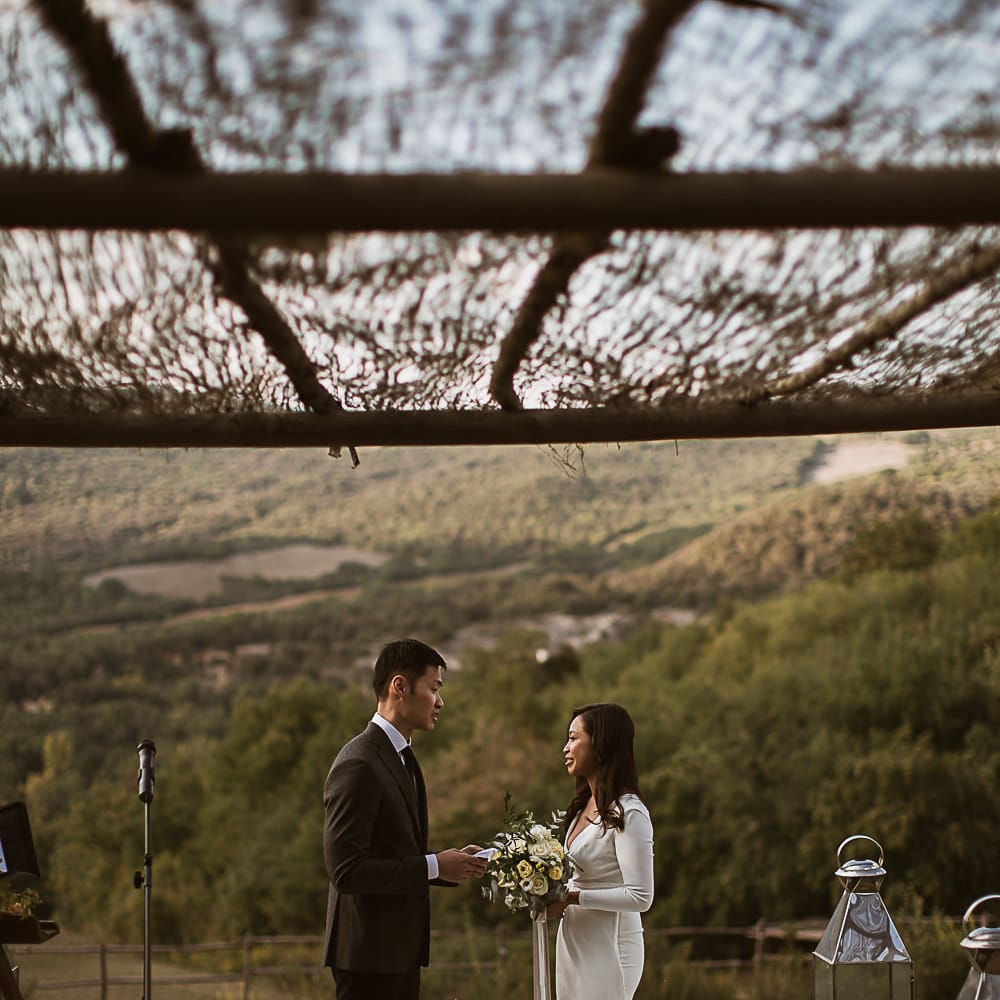 Intimate Tuscan Wedding at WP Relais, Castiglione D'orcia, Siena | Outdoor Reception with Fairy Light Decor | Bride in Gown from Cargie Threads | The Springles Photography