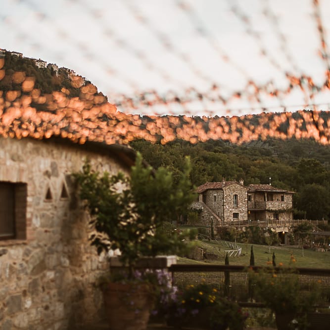 Intimate Tuscan Wedding at WP Relais, Castiglione D'orcia, Siena | Outdoor Reception with Fairy Light Decor | Bride in Gown from Cargie Threads | The Springles Photography