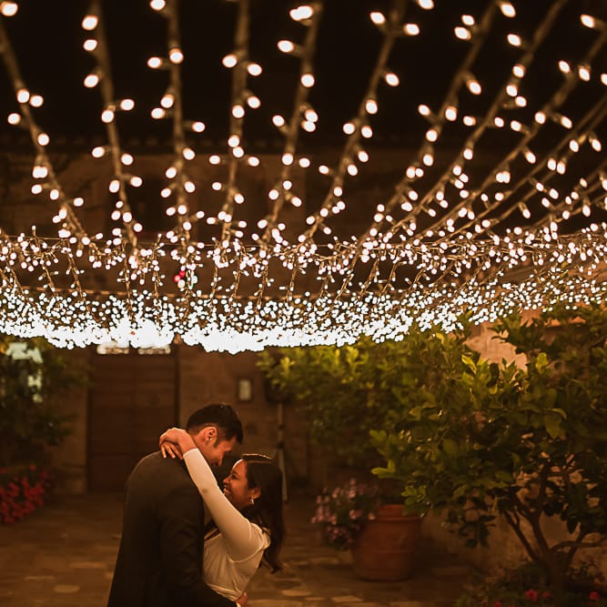 Intimate Tuscan Wedding at WP Relais, Castiglione D'orcia, Siena | Outdoor Reception with Fairy Light Decor | Bride in Gown from Cargie Threads | The Springles Photography