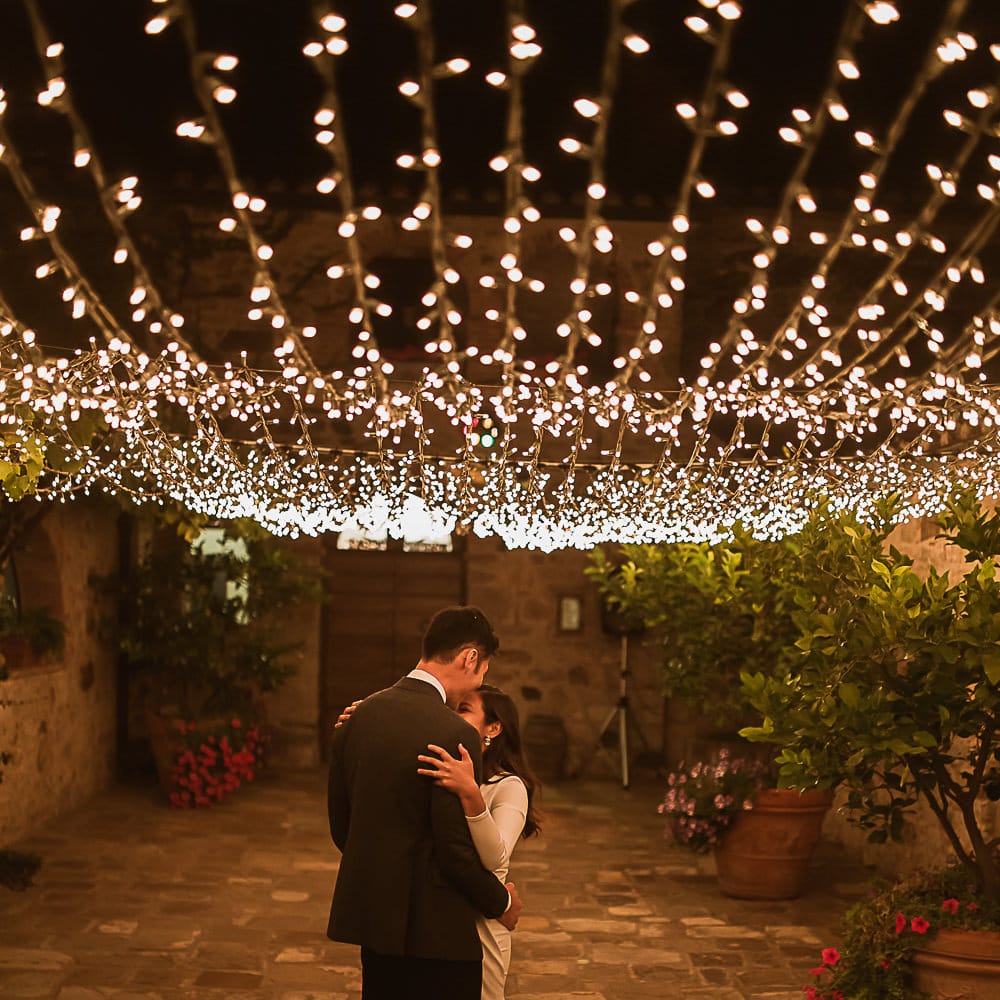 Intimate Tuscan Wedding at WP Relais, Castiglione D'orcia, Siena | Outdoor Reception with Fairy Light Decor | Bride in Gown from Cargie Threads | The Springles Photography
