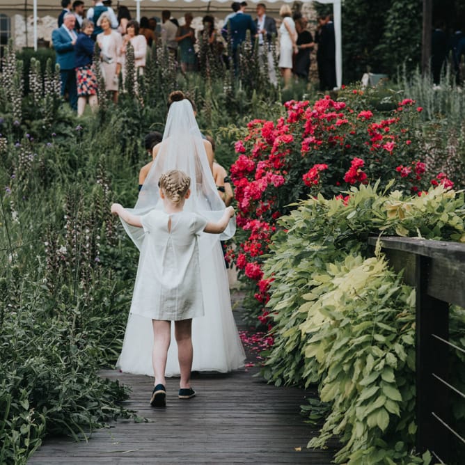 Flower Girl Holding the Brides Veil