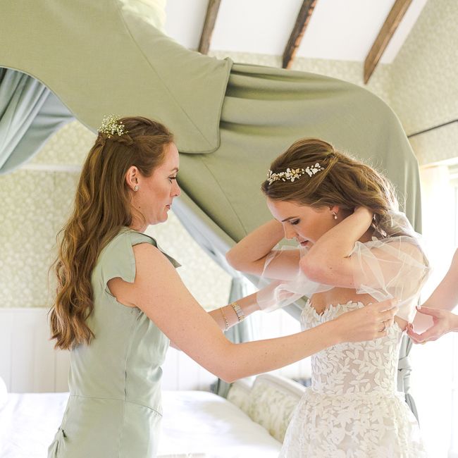 Bridal Preparations | Bride in Mira Zwillinger Bridal Gown | Pale Green Ghost Bridesmaid Dresses | Rustic Soho Farmhouse Ceremony with PapaKata Sperry Tent Greenery filled Reception | Marianne Taylor Photography | Will Warr Films