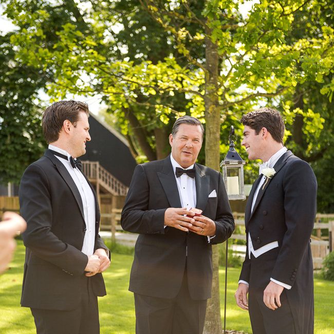 Groom in Black Tie Suit | Rustic Soho Farmhouse Ceremony with PapaKata Sperry Tent Greenery filled Reception | Marianne Taylor Photography | Will Warr Films
