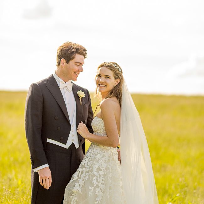 Bride in Mira Zwillinger Bridal Gown | Groom in Black Tie | Rustic Soho Farmhouse Ceremony with PapaKata Sperry Tent Greenery filled Reception | Marianne Taylor Photography | Will Warr Films