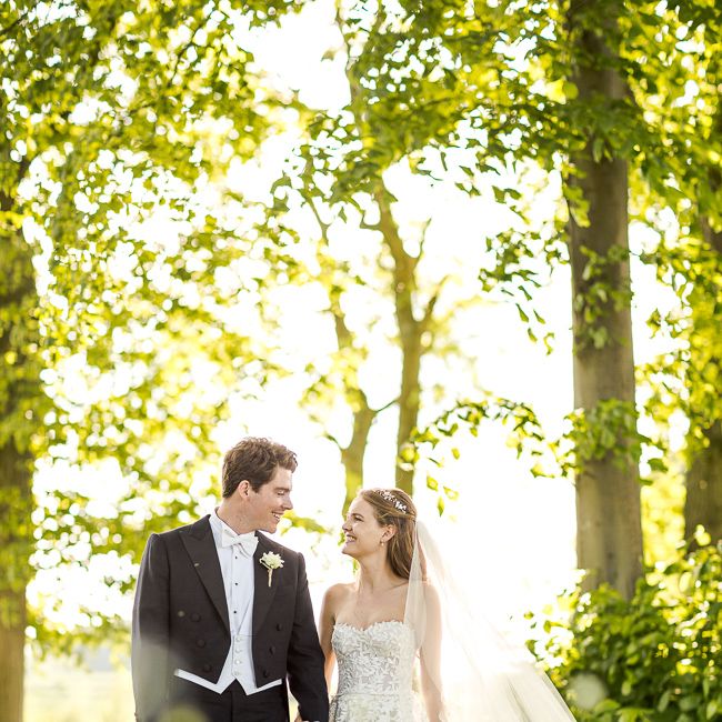 Bride in Mira Zwillinger Bridal Gown | Groom in Black Tie | Rustic Soho Farmhouse Ceremony with PapaKata Sperry Tent Greenery filled Reception | Marianne Taylor Photography | Will Warr Films