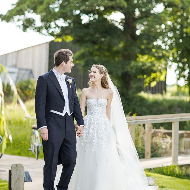 Bride in Mira Zwillinger Bridal Gown | Groom in Black Tie | Rustic Soho Farmhouse Ceremony with PapaKata Sperry Tent Greenery filled Reception | Marianne Taylor Photography | Will Warr Films