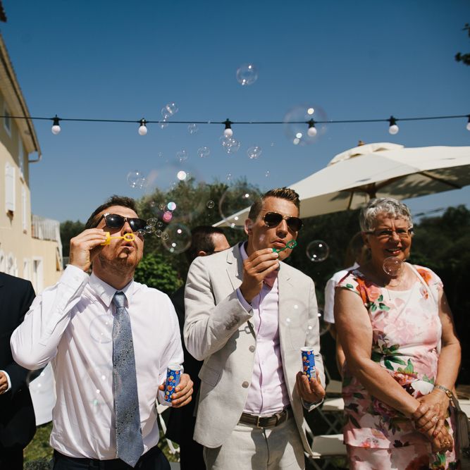 Wedding Guests Blowing Bubbles