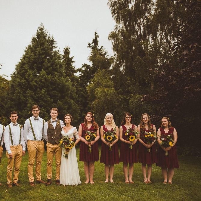 Wedding Party In Yellow Trousers And Red Bridesmaids Dresses