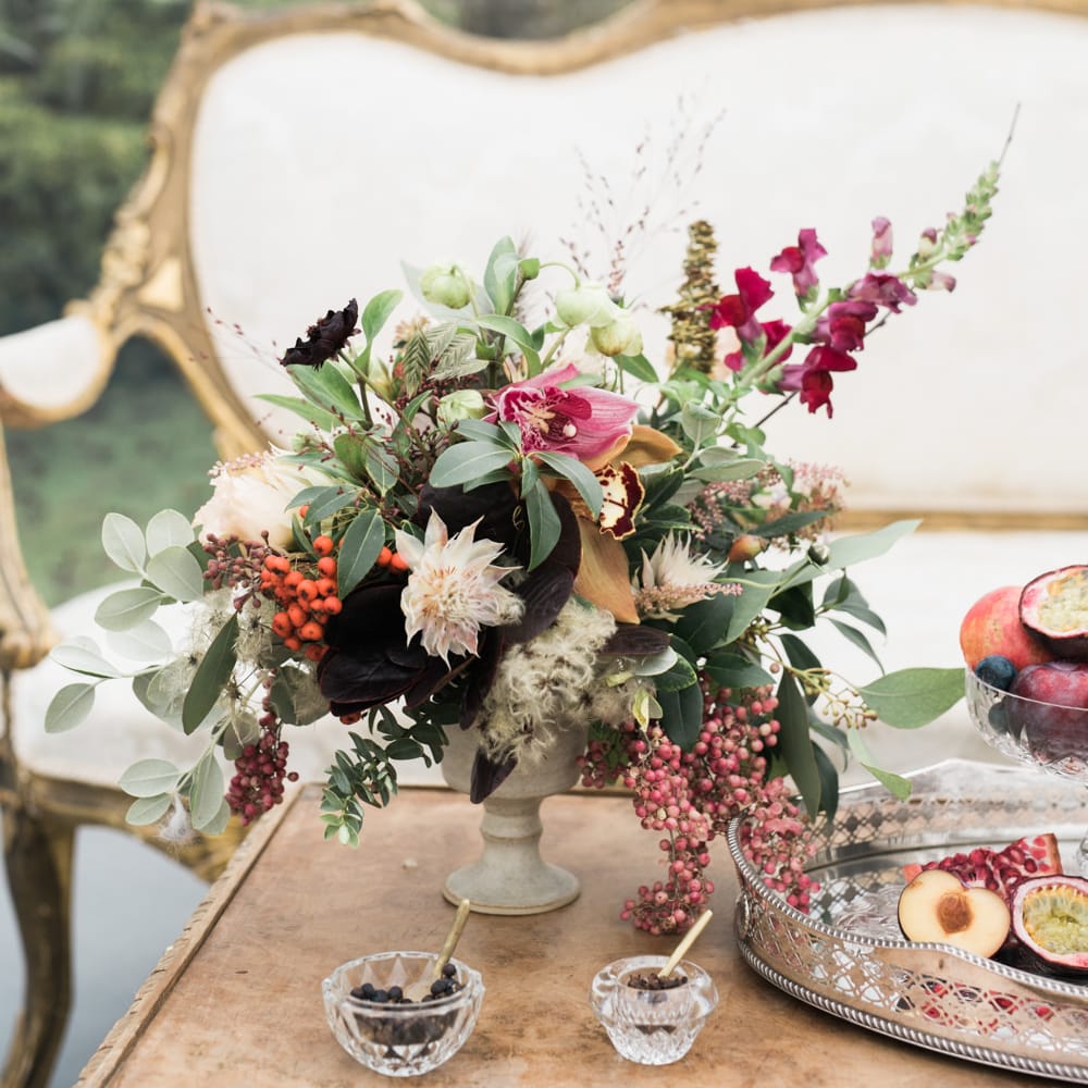 Elegant Sofa & Floral Arrangement | Autumnal Decadence Wedding Inspiration at Twyning Park Styled by For The Love of Weddings | Red, Gold & Blush Colour Scheme | Captured by Katrina Photography